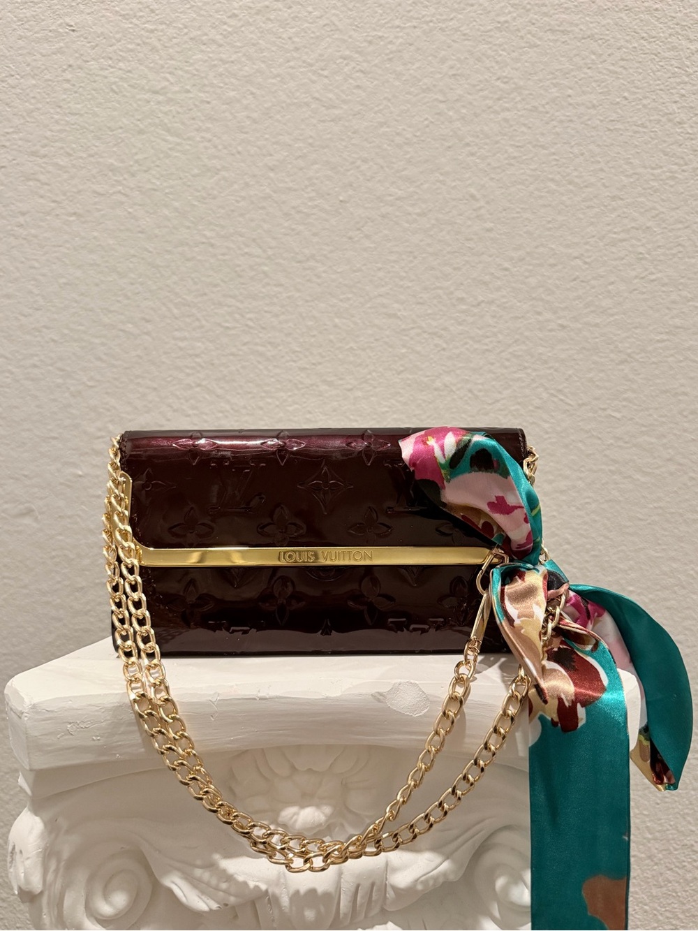 Authentic Louis Vuitton Monogram Vernis Ana Clutch in Amarante.
